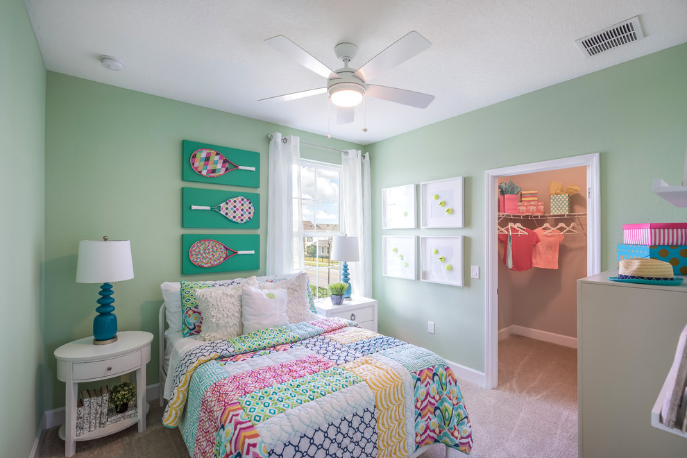 Classic kids' bedroom in Orlando with carpet, beige floors and green walls.