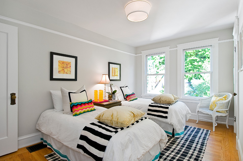 Eclectic girl medium tone wood floor and beige floor kids' room photo in San Francisco with gray walls