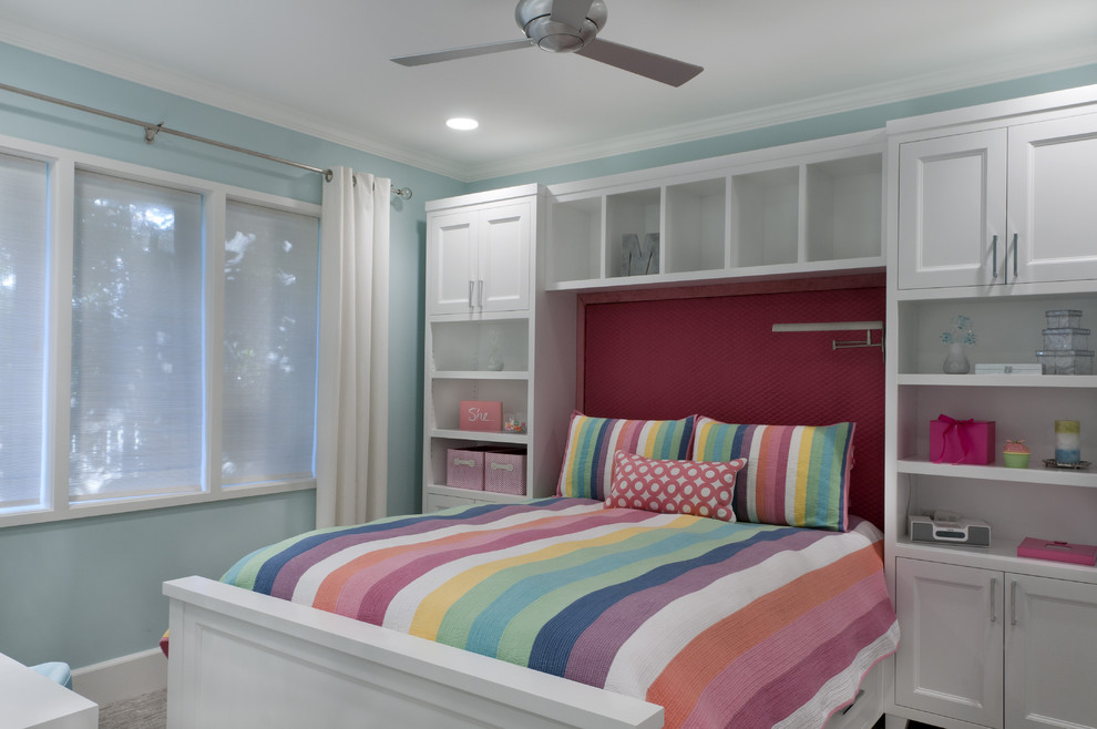 Photo of a classic kids' bedroom for girls in Sacramento with blue walls.