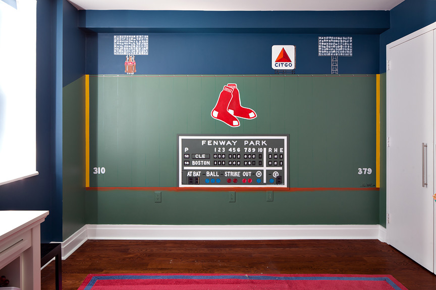 Idée de décoration pour une chambre d'enfant de 4 à 10 ans design de taille moyenne avec un mur bleu et un sol en bois brun.