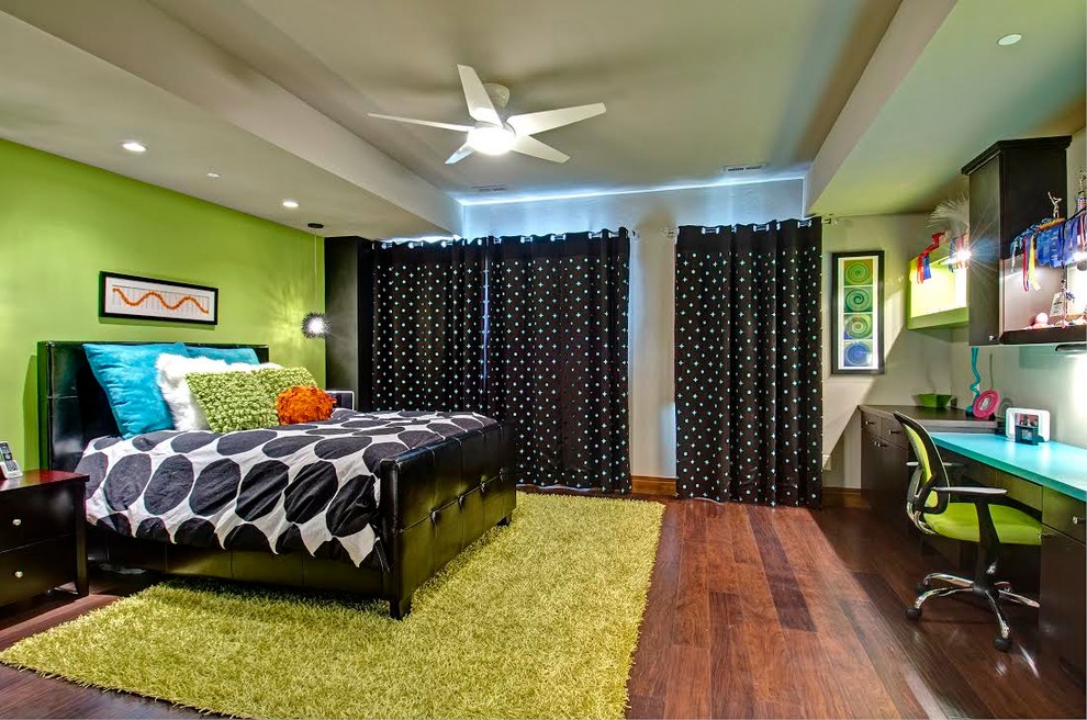 Example of a mid-sized trendy gender-neutral dark wood floor kids' room design in Denver with green walls