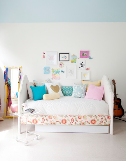 Eclectic teen’s room for girls in Vancouver with white walls and cork flooring.