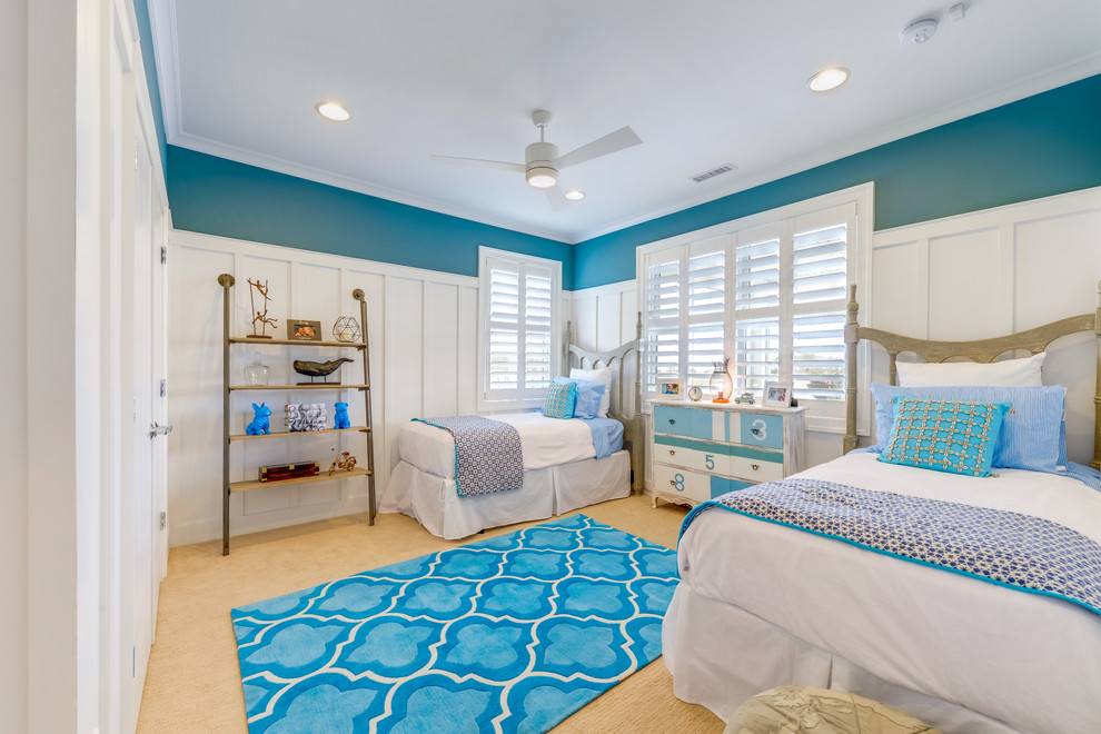 Photo of a coastal teen’s room for girls in Other with blue walls, carpet and beige floors.