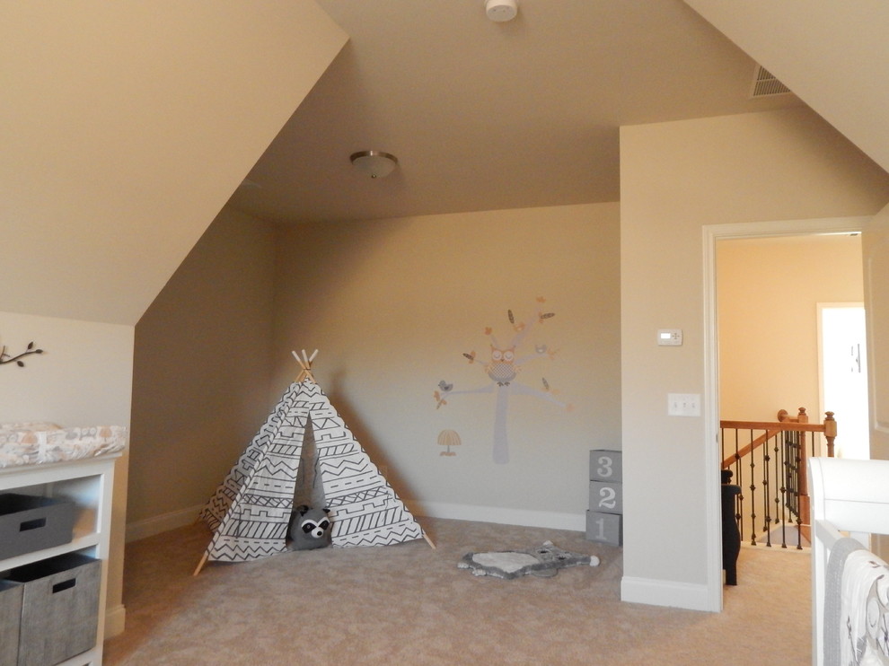 Small traditional children’s room for girls in Atlanta with beige walls and dark hardwood flooring.