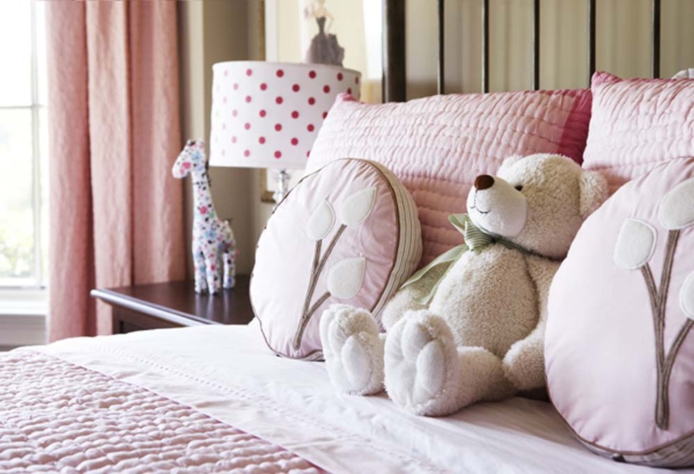 This is an example of a large contemporary children’s room for girls in Other with beige walls.