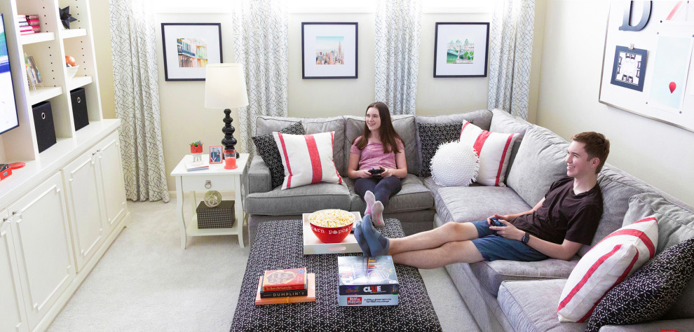 Photo of a medium sized traditional gender neutral teen’s room in Houston with grey walls, carpet and grey floors.