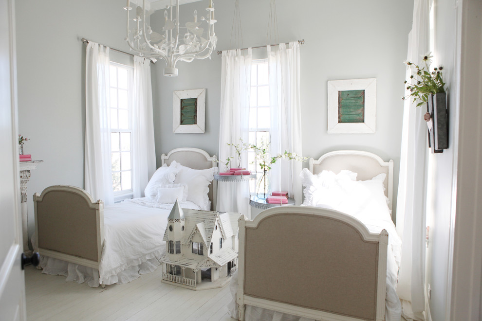 Inspiration for a small country girl painted wood floor kids' room remodel in Austin with gray walls