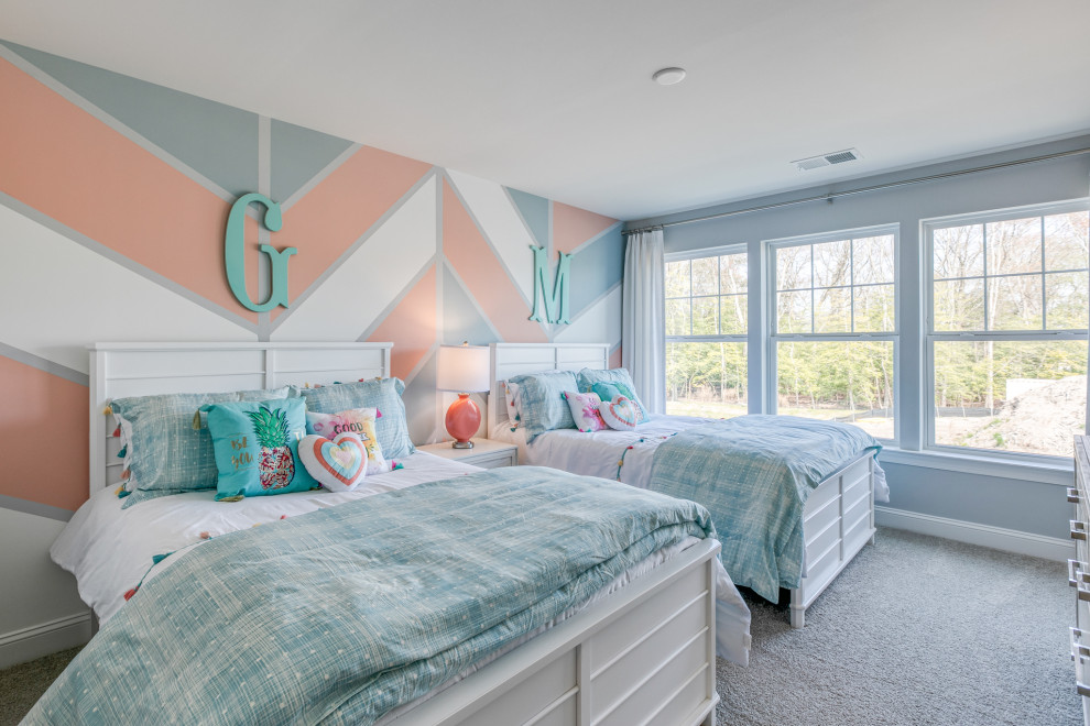 Photo of a large traditional children’s room for girls in Wilmington with blue walls, carpet and grey floors.