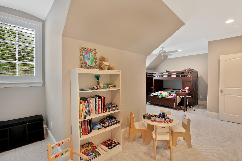 Photo of an expansive traditional gender neutral children’s room in Richmond with beige walls and carpet.