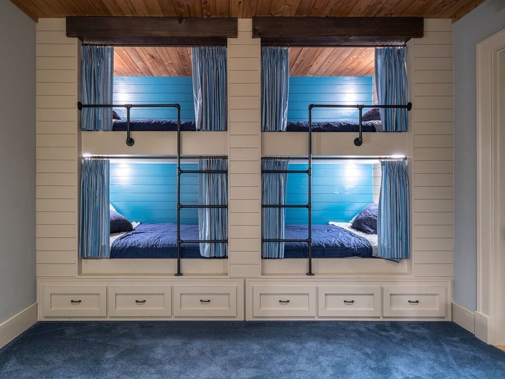 Idee per una cameretta per bambini rustica con pareti blu e moquette