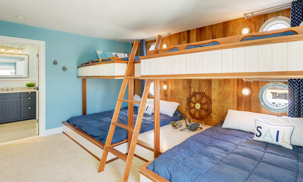 Cette image montre une chambre d'enfant de 4 à 10 ans marine avec un mur bleu et un lit superposé.