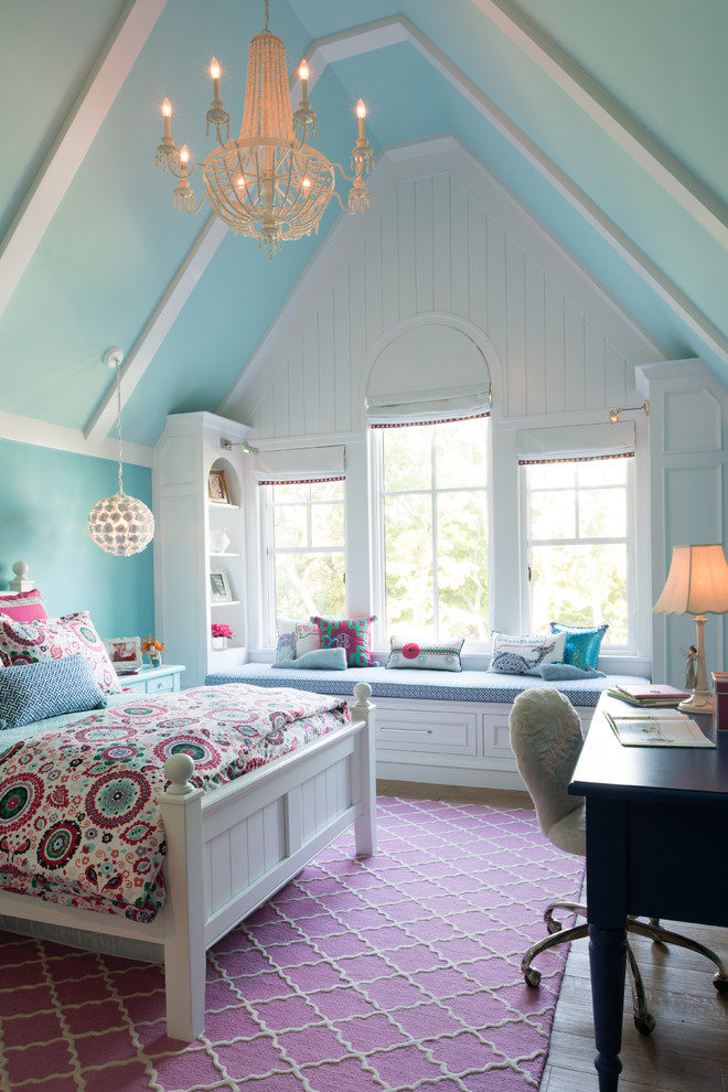 Classic kids' bedroom for girls in Minneapolis with blue walls, light hardwood flooring and beige floors.