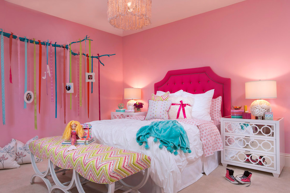 This is an example of a medium sized contemporary children’s room for girls in Tampa with pink walls and carpet.