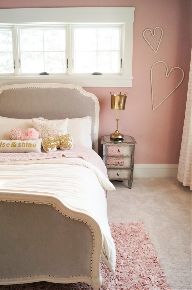 Photo of a medium sized classic children’s room for girls in Other with pink walls, carpet and beige floors.