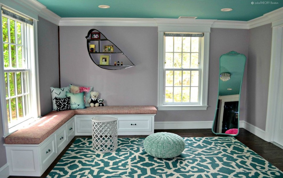 Inspiration for a mid-sized transitional girl medium tone wood floor kids' room remodel in Boston with purple walls