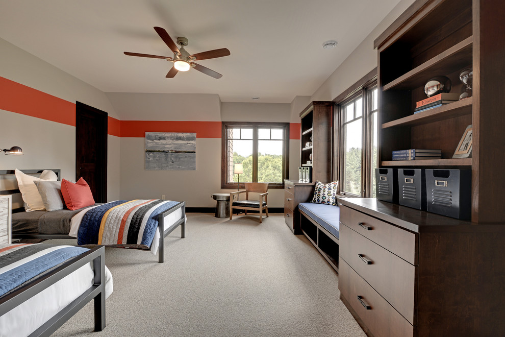 This is an example of an expansive traditional children’s room for boys in Minneapolis with grey walls and carpet.