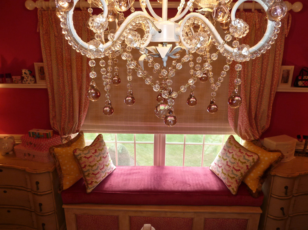 Example of a mid-sized transitional girl carpeted kids' room design in New York with pink walls