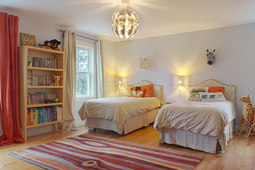 Kids' room - mid-sized transitional gender-neutral light wood floor kids' room idea in Boston with gray walls