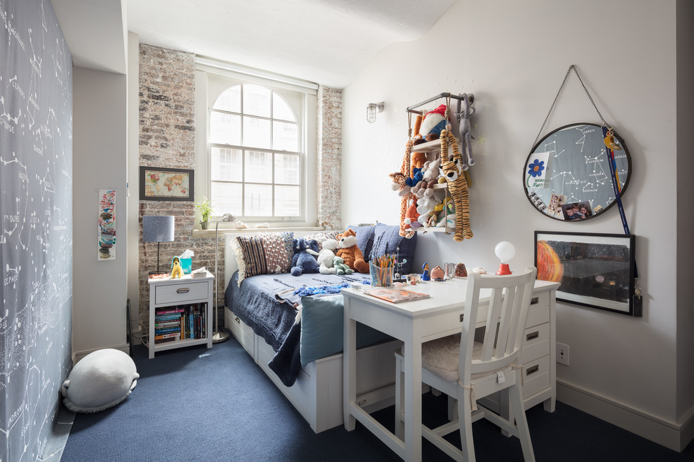 Inspiration for an industrial kids' bedroom in New York with white walls, carpet and blue floors.