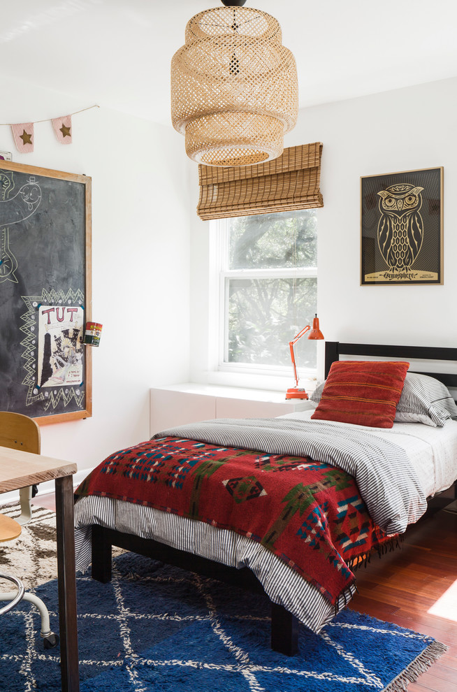 Mid-sized eclectic boy dark wood floor and brown floor kids' room photo in Austin with white walls