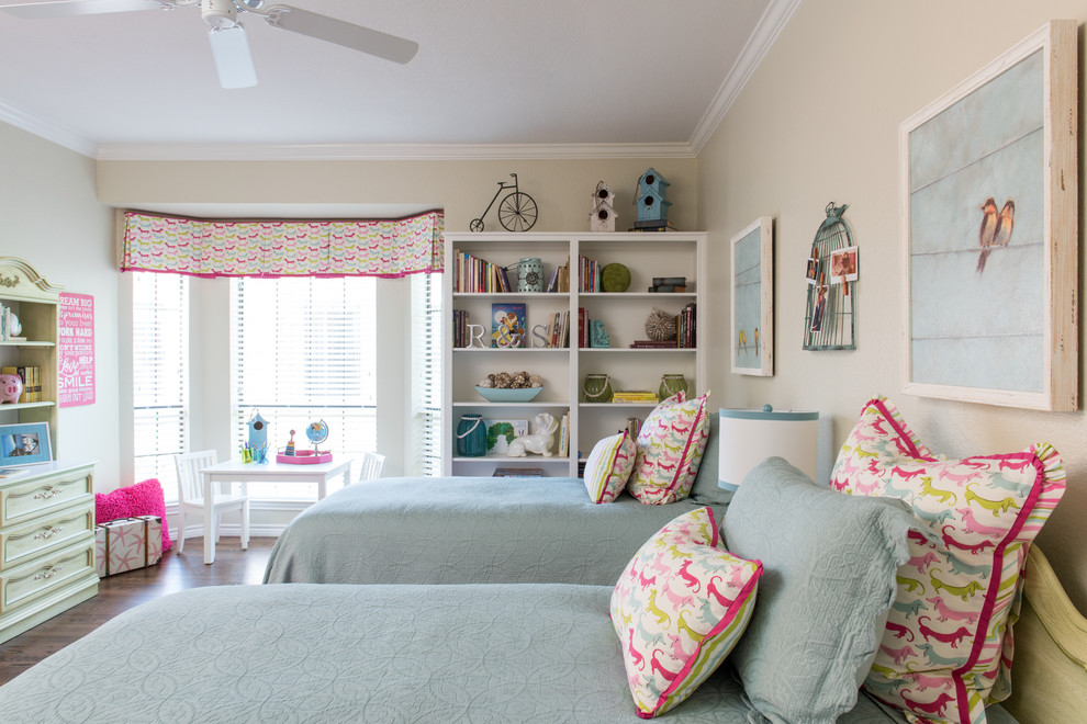 Mid-sized elegant medium tone wood floor kids' bedroom photo in Dallas with beige walls