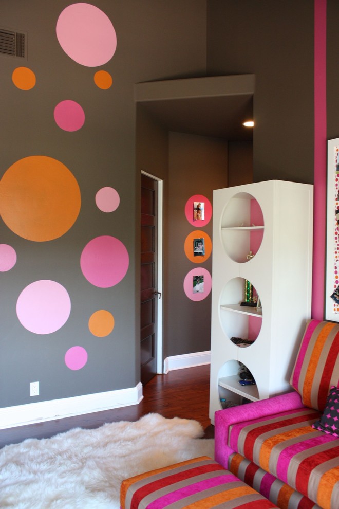 Teen room - contemporary medium tone wood floor and brown floor teen room idea in Orange County with multicolored walls