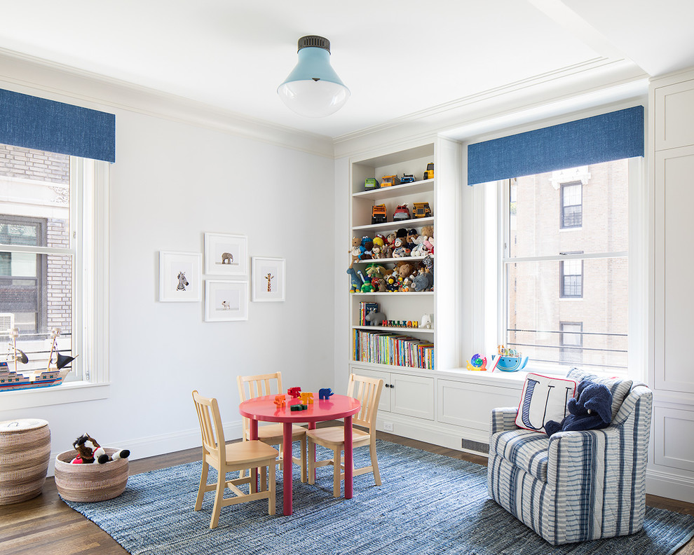 Design ideas for a classic playroom in New York with white walls, medium hardwood flooring and brown floors.