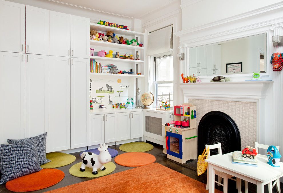 Photo of a classic gender neutral playroom in New York with white walls and dark hardwood flooring.