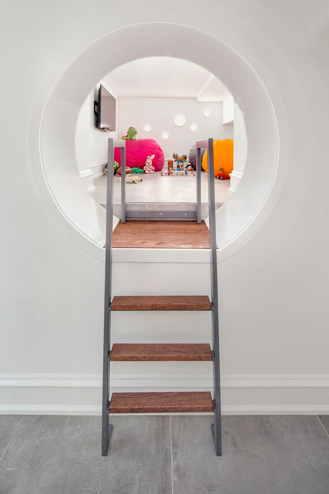 Classic gender neutral playroom in New York with white walls.