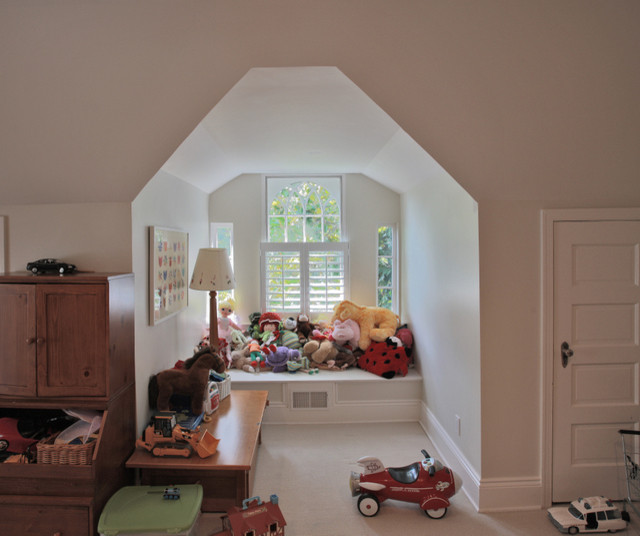 Inspiration for a medium sized classic gender neutral playroom in DC Metro with beige walls, carpet and beige floors.
