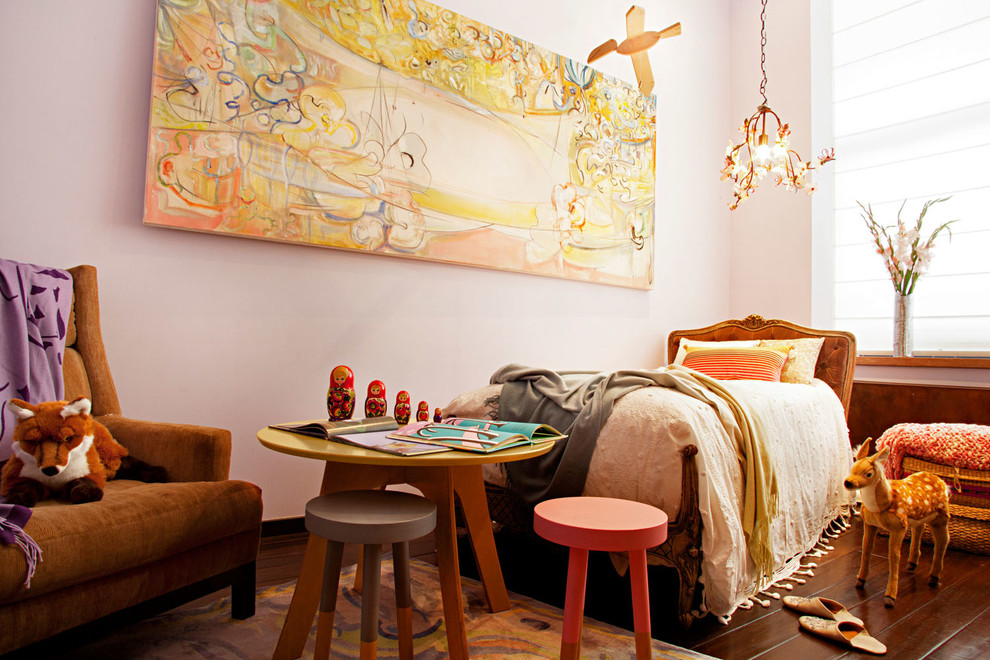 Inspiration for an eclectic girl kids' room remodel in New York with pink walls