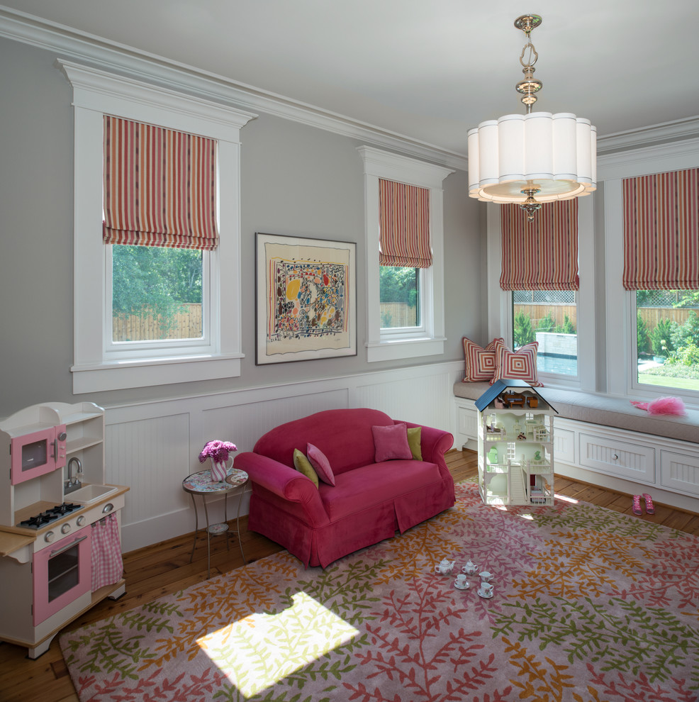 Inspiration for a large classic kids' bedroom for girls in Houston with grey walls and light hardwood flooring.