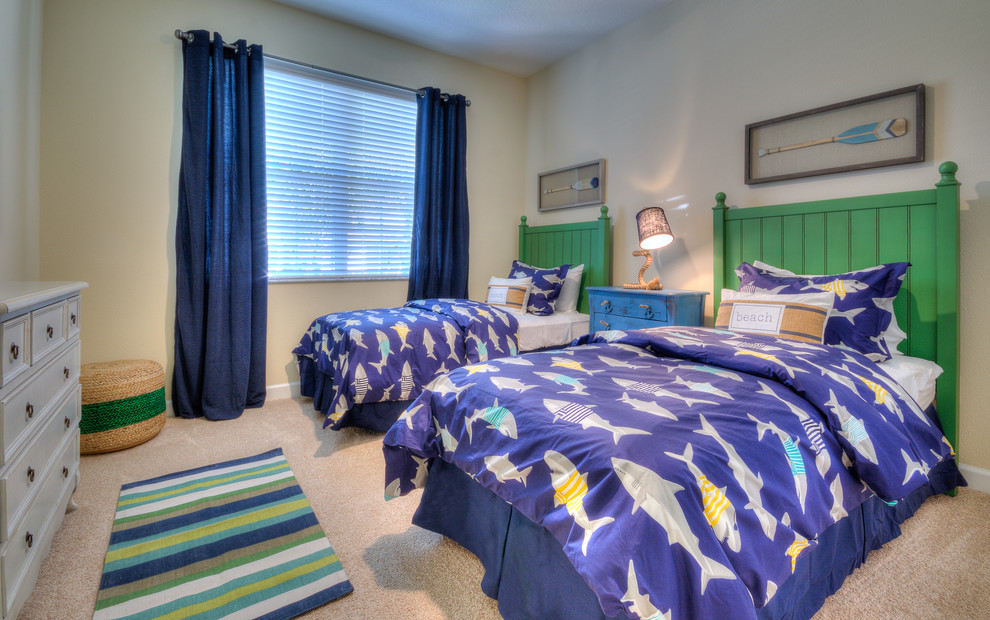 Medium sized coastal children’s room for boys in Orlando with beige walls, carpet and beige floors.