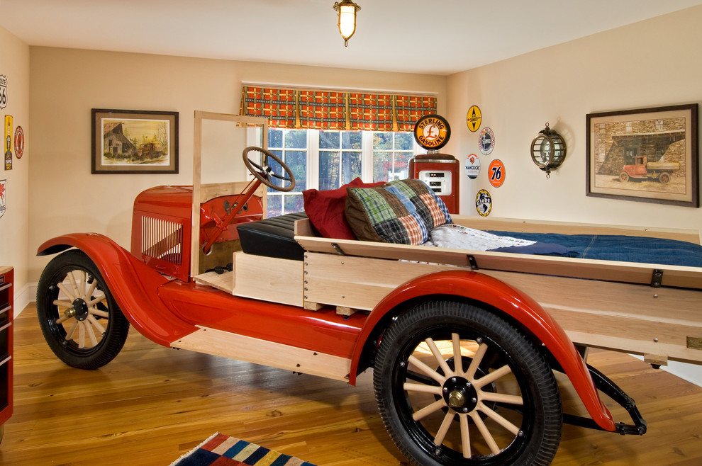 Inspiration for an eclectic boy medium tone wood floor kids' room remodel in New York with beige walls