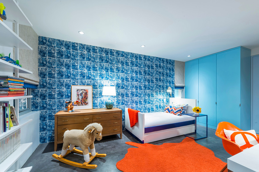 This is an example of a contemporary kids' bedroom for girls in Los Angeles with blue walls.
