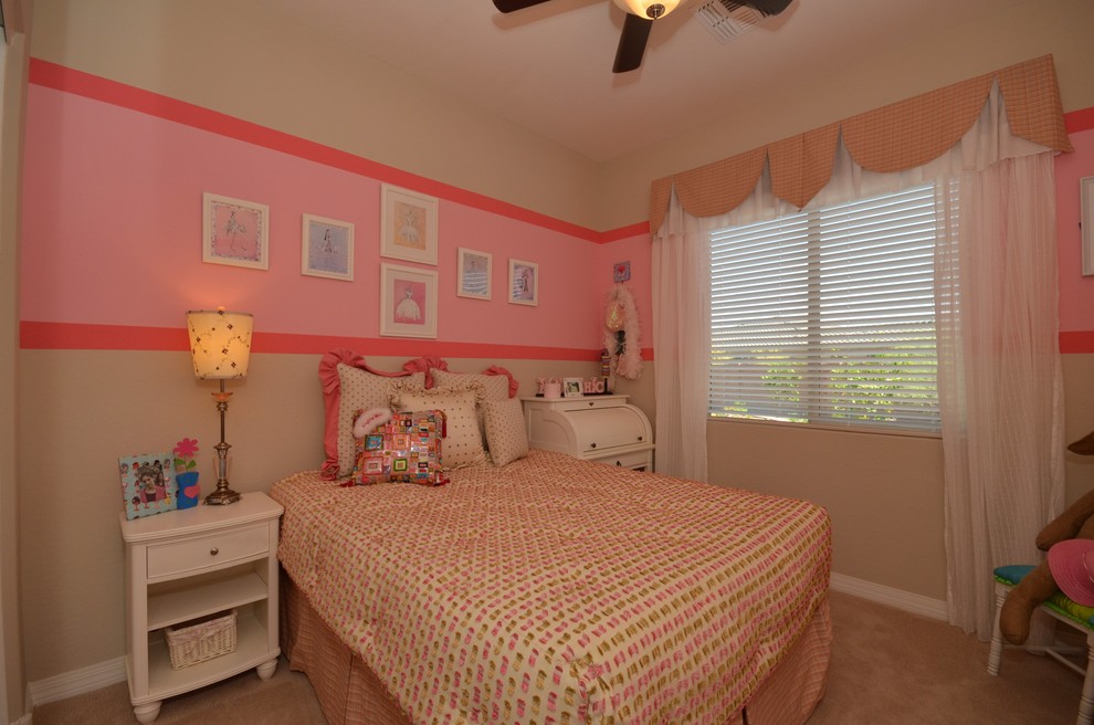 Photo of a medium sized classic children’s room for girls in Phoenix with multi-coloured walls and carpet.