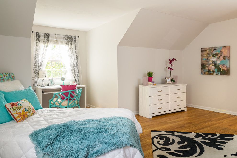Mid-sized transitional girl medium tone wood floor and brown floor kids' room photo in St Louis with white walls