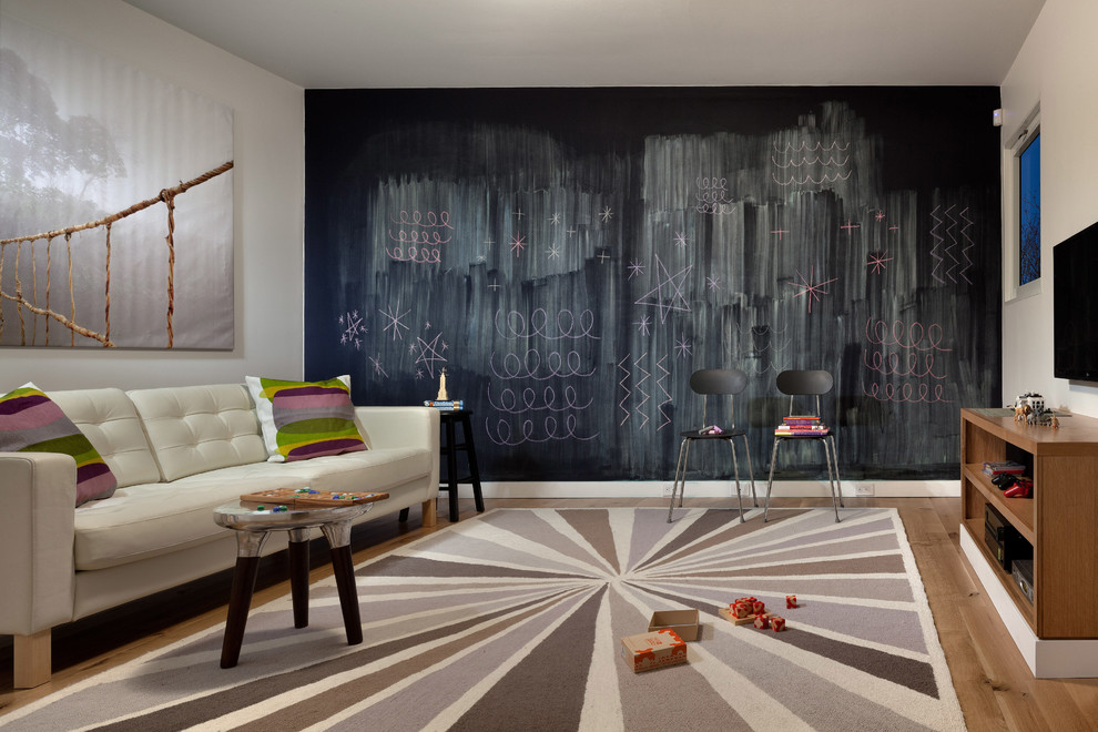 Playroom - contemporary gender-neutral medium tone wood floor playroom idea in Providence with black walls