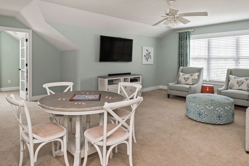 Example of a large transitional girl carpeted kids' room design in Charlotte with blue walls
