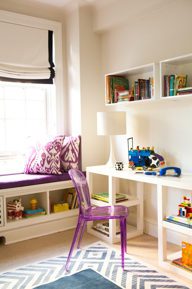 Example of a trendy girl carpeted kids' room design in New York with beige walls