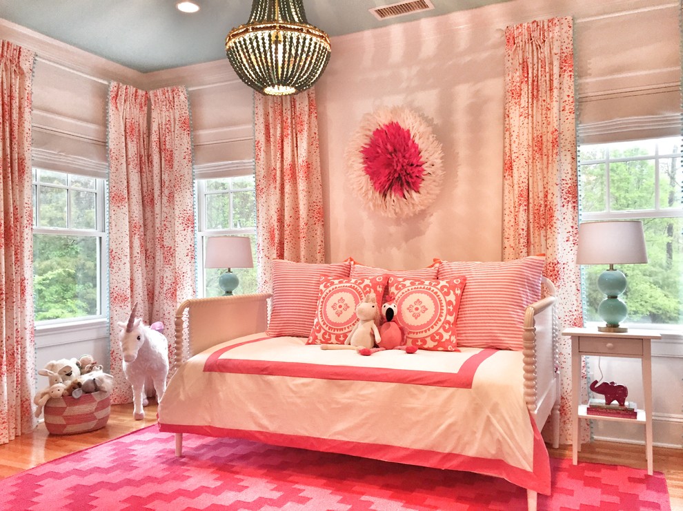 Design ideas for a traditional children’s room for girls in New York with white walls and medium hardwood flooring.