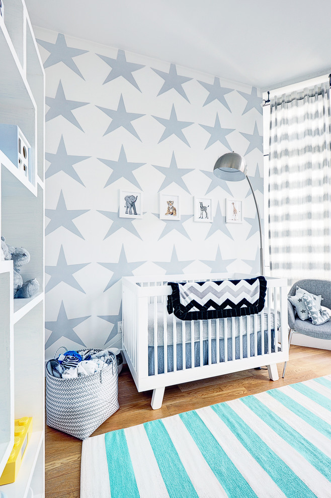 Example of a mid-sized minimalist kids' room design in New York