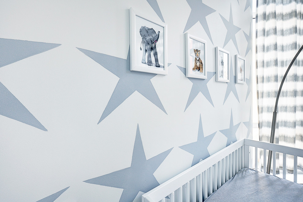 Example of a mid-sized minimalist kids' room design in New York