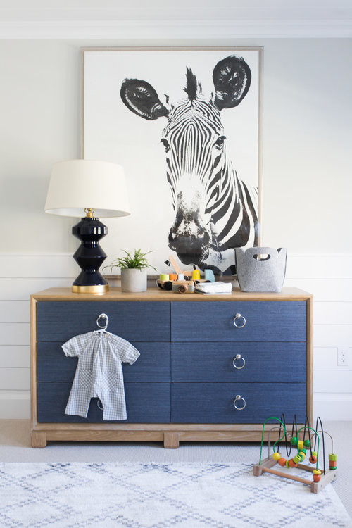 Inspiration for a mid-sized coastal boy medium tone wood floor kids' room remodel in Salt Lake City with white walls