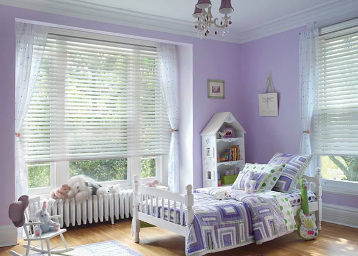 Example of a mid-sized eclectic girl light wood floor kids' room design in Sacramento with purple walls