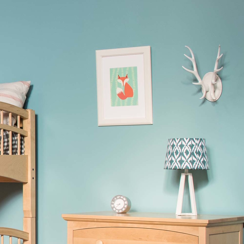 Photo of a rustic gender neutral children’s room in Seattle with blue walls and medium hardwood flooring.