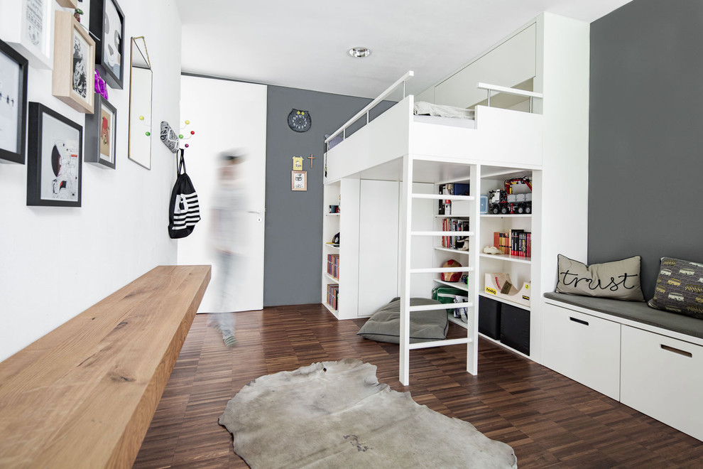 Photo of a medium sized scandi teen’s room for boys in Munich with grey walls.