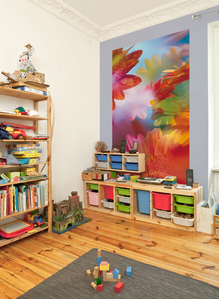 Kids' room - mid-sized traditional girl medium tone wood floor kids' room idea in Berlin with multicolored walls
