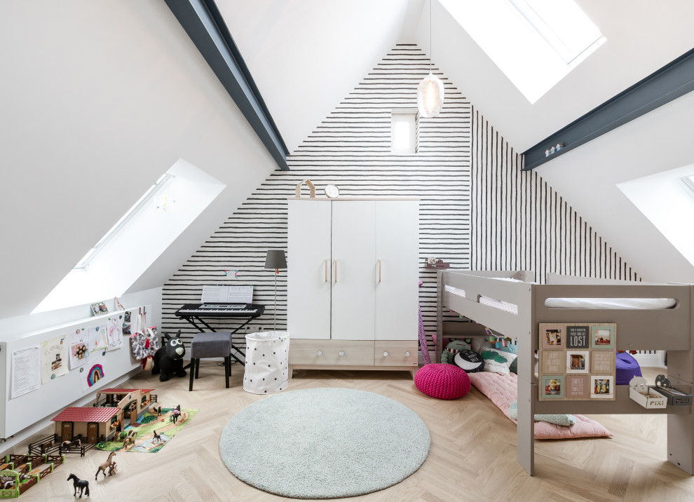 Trendy light wood floor, beige floor, vaulted ceiling and wallpaper playroom photo in Stuttgart with white walls