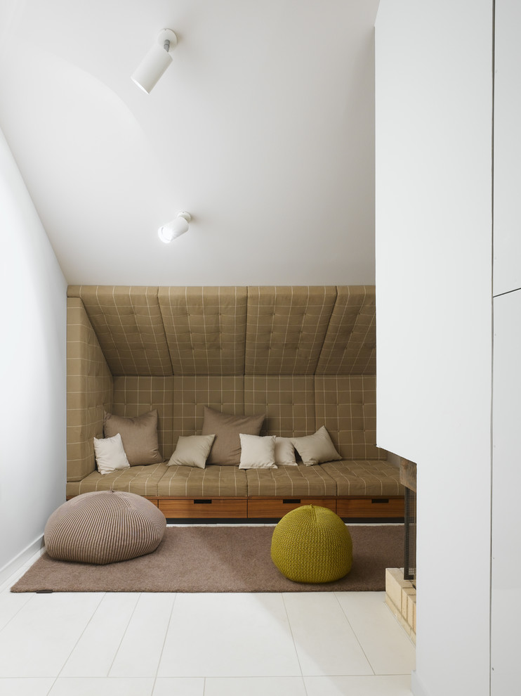 Design ideas for a medium sized contemporary gender neutral playroom in Stuttgart with white walls.